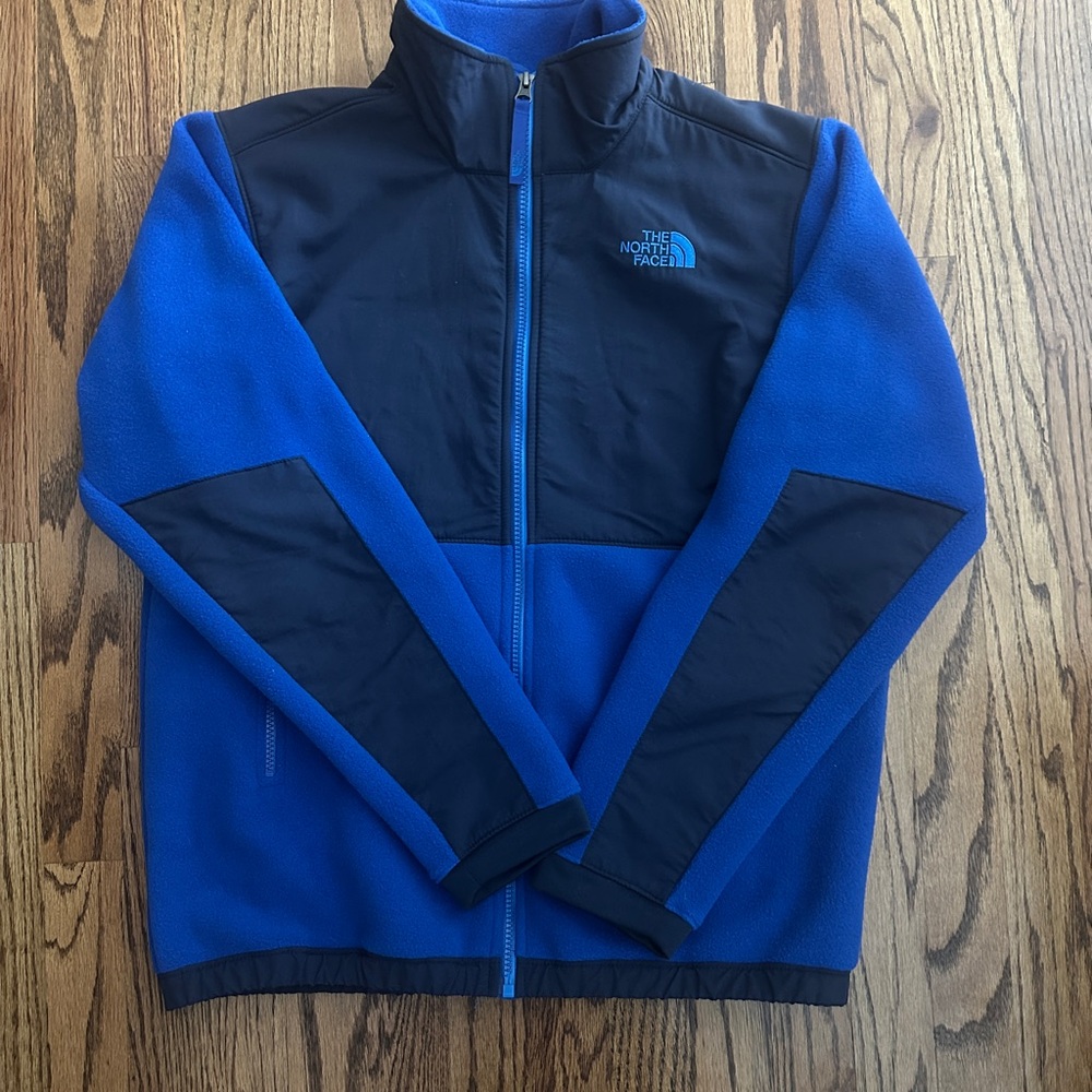 The North Face Blue Puffer Jacket with Full Zip and Stand Up Collar